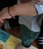 PAIR OF BLACK AND GOLD BEAD BABY BRACELETS
